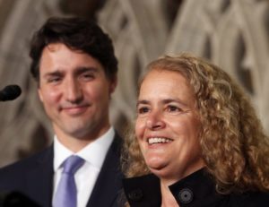 Prime Minister Justin Trudeau looks on as former astronaut, and Governor General designate, Julie Payette,talks to reporters, on Parliament Hill, in Ottawa, Thursday July 13, 2017. THE CANADIAN PRESS/Fred Chartrand